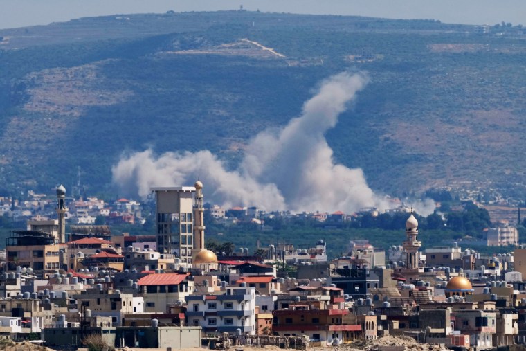 Smoke rises from an Israeli airstrike that hit Qlaileh village, as seen from the southern port city of Tyre, Lebanon,