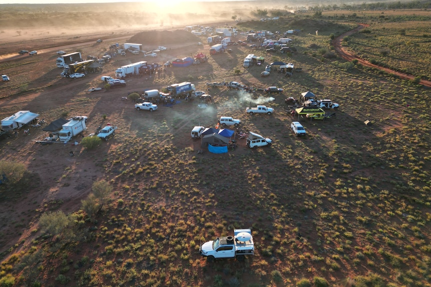 Hundreds of people camp in the desert