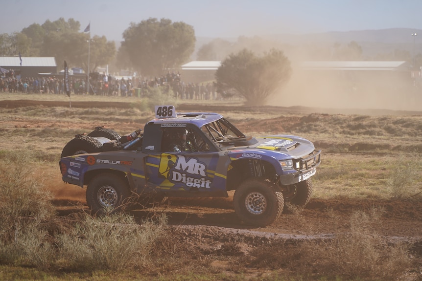 A 4WD racing along a desert track
