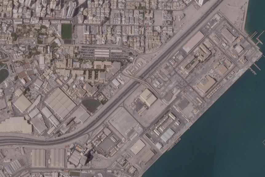 A satellite image shows the US Fifth Fleet naval base.