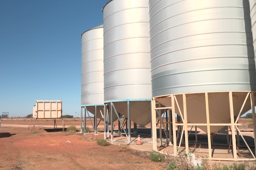 Three silos and a ute.