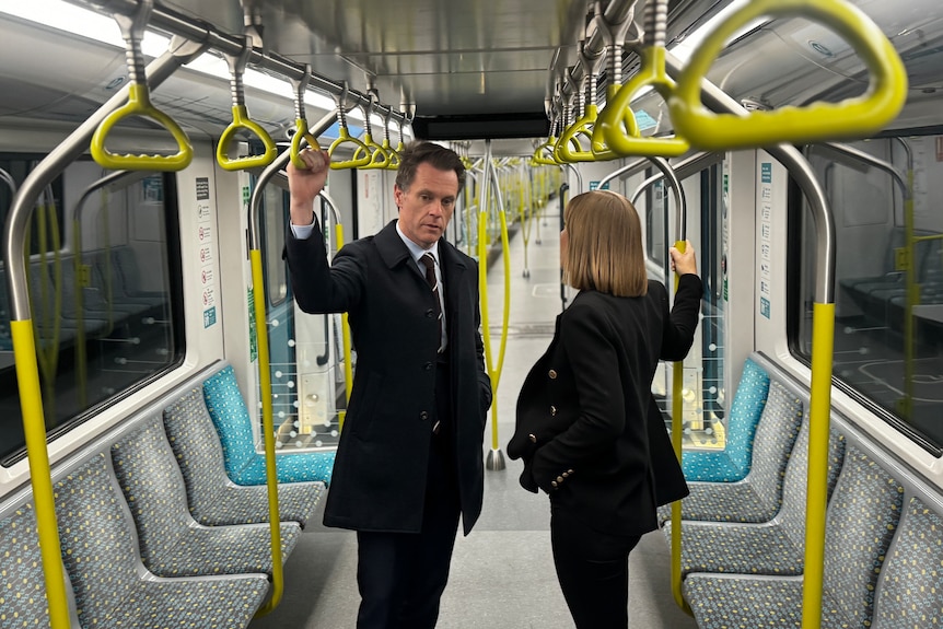 NSW Premier Chris Minns and transport minister Jo Haylen ride a Sydney metro