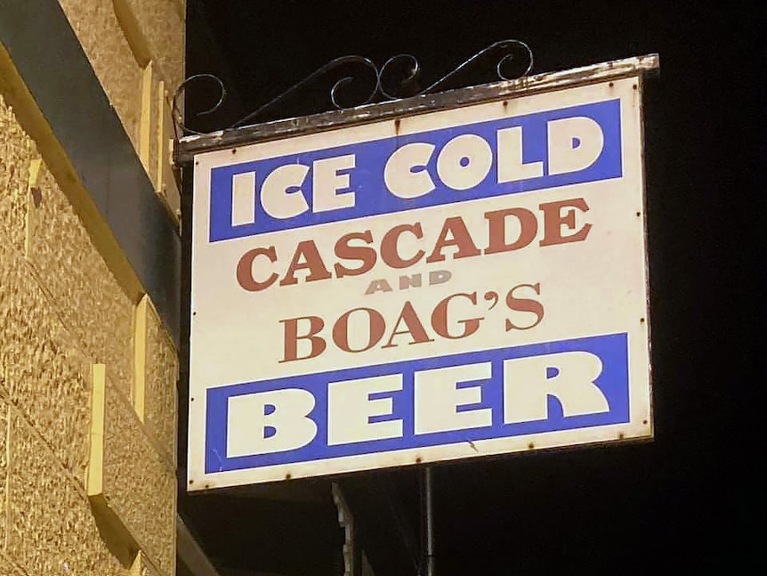 A sign for Cascade and Boag's beer on the side of a building.