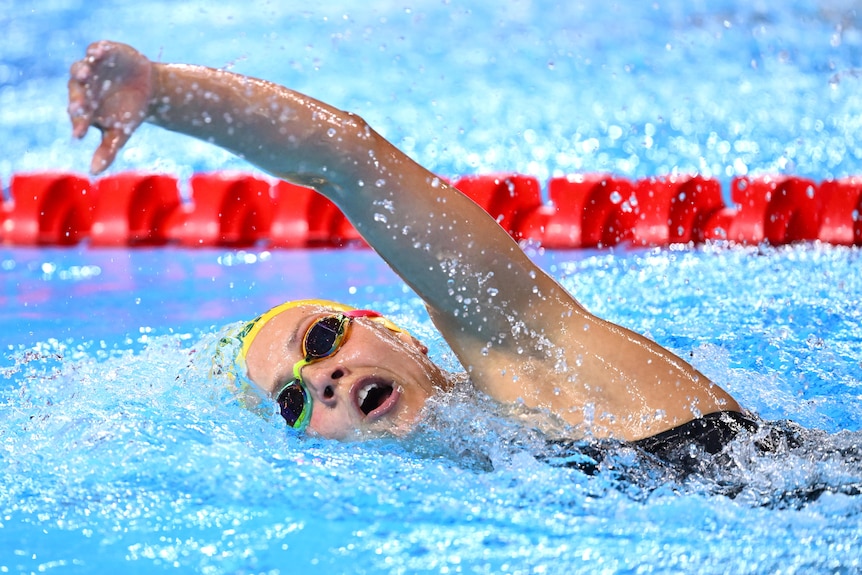 Moesha Johnson swims in a pool