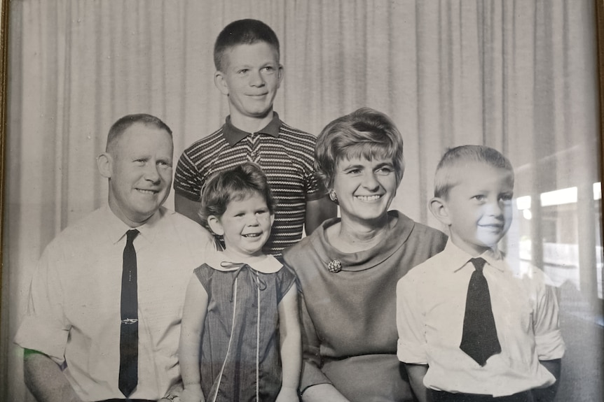 Black and white photo of parents with two sons and a daughter.