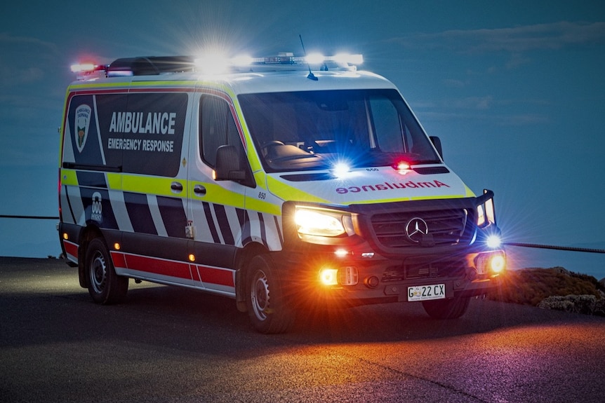 Ambulance driving on an unidentified road.